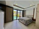 Modern bedroom with direct pool access through sliding glass doors