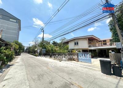 Exterior street view showing a residential neighborhood with detached houses