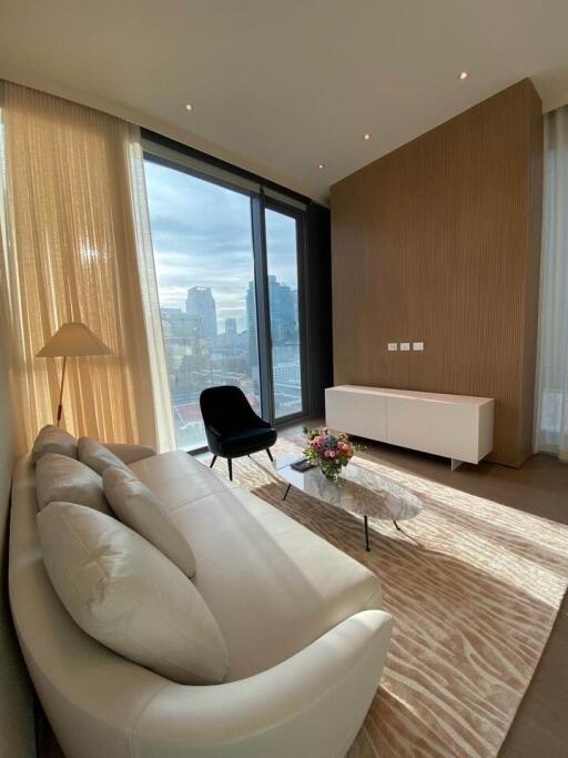 Elegant living room with large window and city view