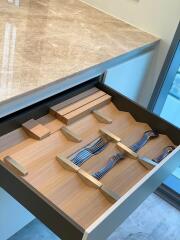 Modern kitchen drawer with organized cutlery