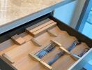 Modern kitchen drawer with organized cutlery