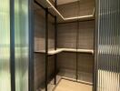 Modern walk-in closet with shelves and stylish lighting