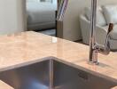 Modern kitchen sink with a stylish faucet on a marble countertop