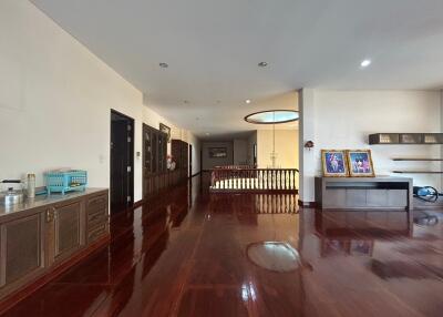 Spacious living room with hardwood floors and elegant furniture