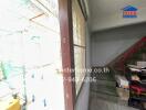 Spacious balcony with stairs and natural light