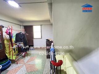 Spacious laundry room with ample storage and drying space