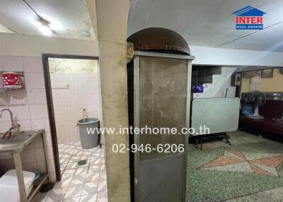 Spacious kitchen with traditional oven and tiled flooring