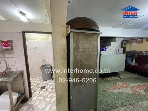 Spacious kitchen with traditional oven and tiled flooring