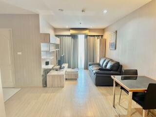 Modern living room with integrated kitchen in an apartment