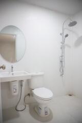 Modern white bathroom with shower and toilet