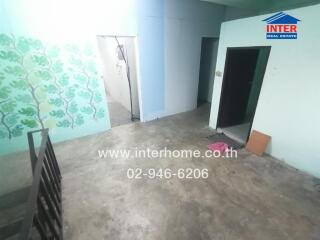 Spacious empty room with blue walls and tiled floor