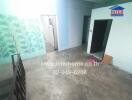 Spacious empty room with blue walls and tiled floor