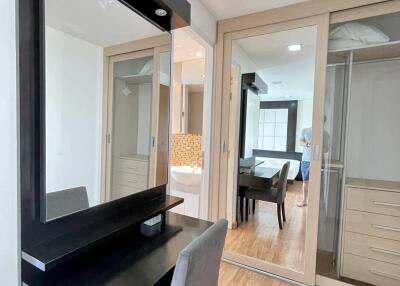 Modern bedroom with vanity mirror and sliding wardrobe doors