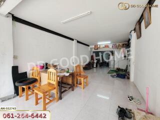 Spacious living area with dining table and chairs