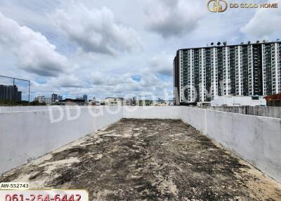 Building rooftop with cloudy sky view