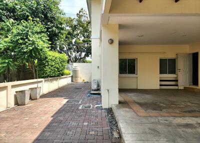 Spacious exterior of a home showing the driveway and part of the entrance