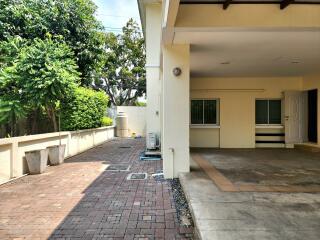 Spacious exterior of a home showing the driveway and part of the entrance