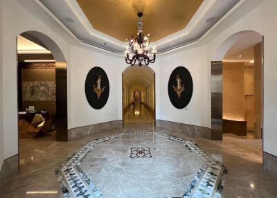 Elegant residential hallway with luxurious marble flooring and sophisticated decor