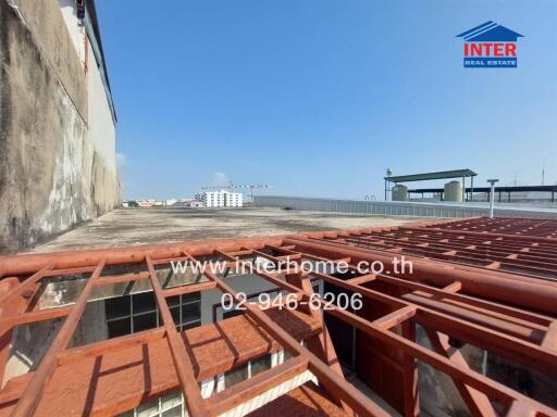 Spacious rooftop area with open view and metal framing