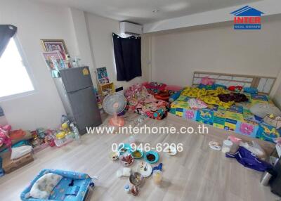 Spacious bedroom with personal items and children