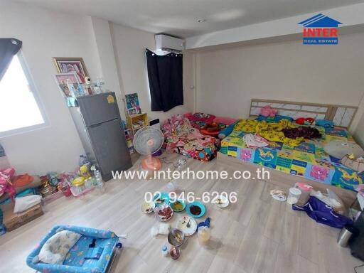 Spacious bedroom with personal items and children