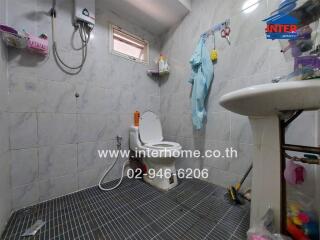 Spacious tiled bathroom with modern fixtures