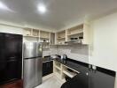 Modern kitchen with stainless steel appliances and ample cabinetry