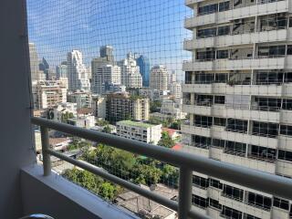 Urban View from High-Rise Apartment Balcony