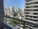 Urban View from High-Rise Apartment Balcony