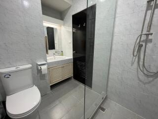 Modern bathroom with glass shower and marble tiling