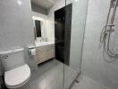 Modern bathroom with glass shower and marble tiling