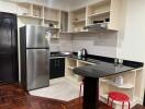 Modern kitchen with stainless steel appliances and spacious counters