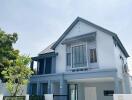 Modern two-story house with blue and white exterior