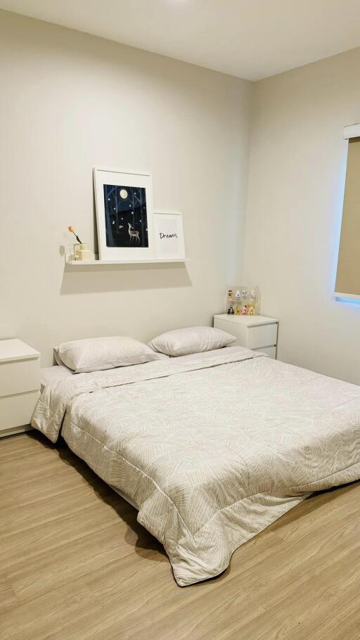 Well-presented bedroom with minimalist decor and soft lighting