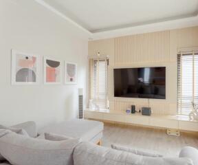 Modern living room with neutral tones and contemporary art