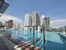 Modern rooftop swimming pool with city skyline view