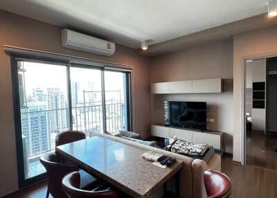 Modern kitchen with dining area and city view