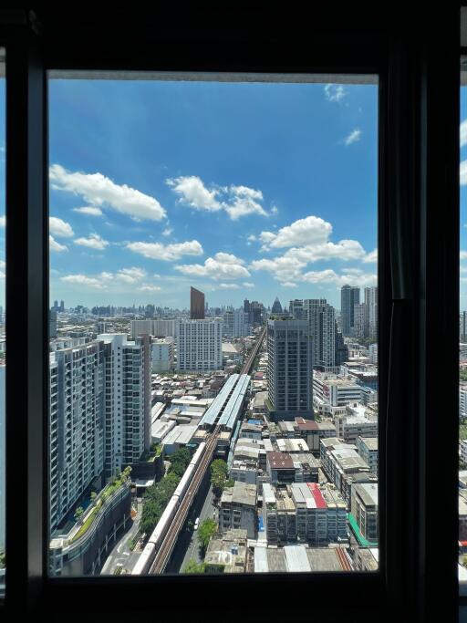 Panoramic city view from a high-rise apartment window