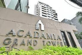 Exterior view of Acadamia Grand Tower with prominent signage