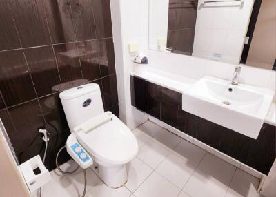 Modern bathroom with electronic toilet and stylish sink