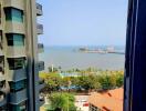 Stunning ocean view from high-rise apartment balcony