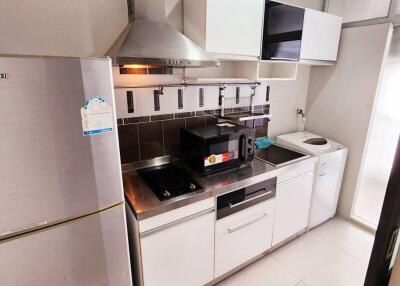 Modern compact kitchen with well-maintained appliances