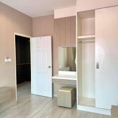 Spacious bedroom with built-in wardrobe and vanity