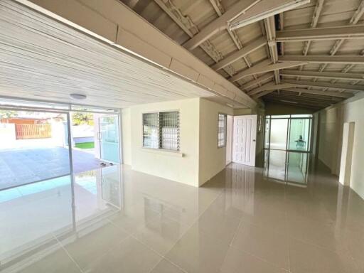 Spacious indoor area leading to an outdoor pool