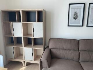 Modern living room with stylish sofa and elegant shelving unit