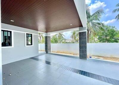 Spacious outdoor patio with high ceiling and tiled floor