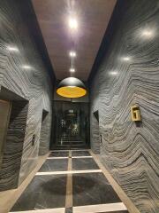 Elegant lobby with distinctive marble walls and stylish lighting