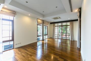 Spacious and well-lit living room with hardwood floors