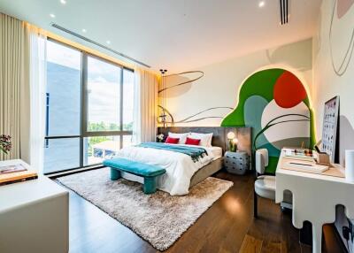Bright and artistic bedroom with large windows and modern decor