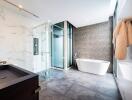 Luxurious modern bathroom with a freestanding tub, glass shower, and elegant finishes